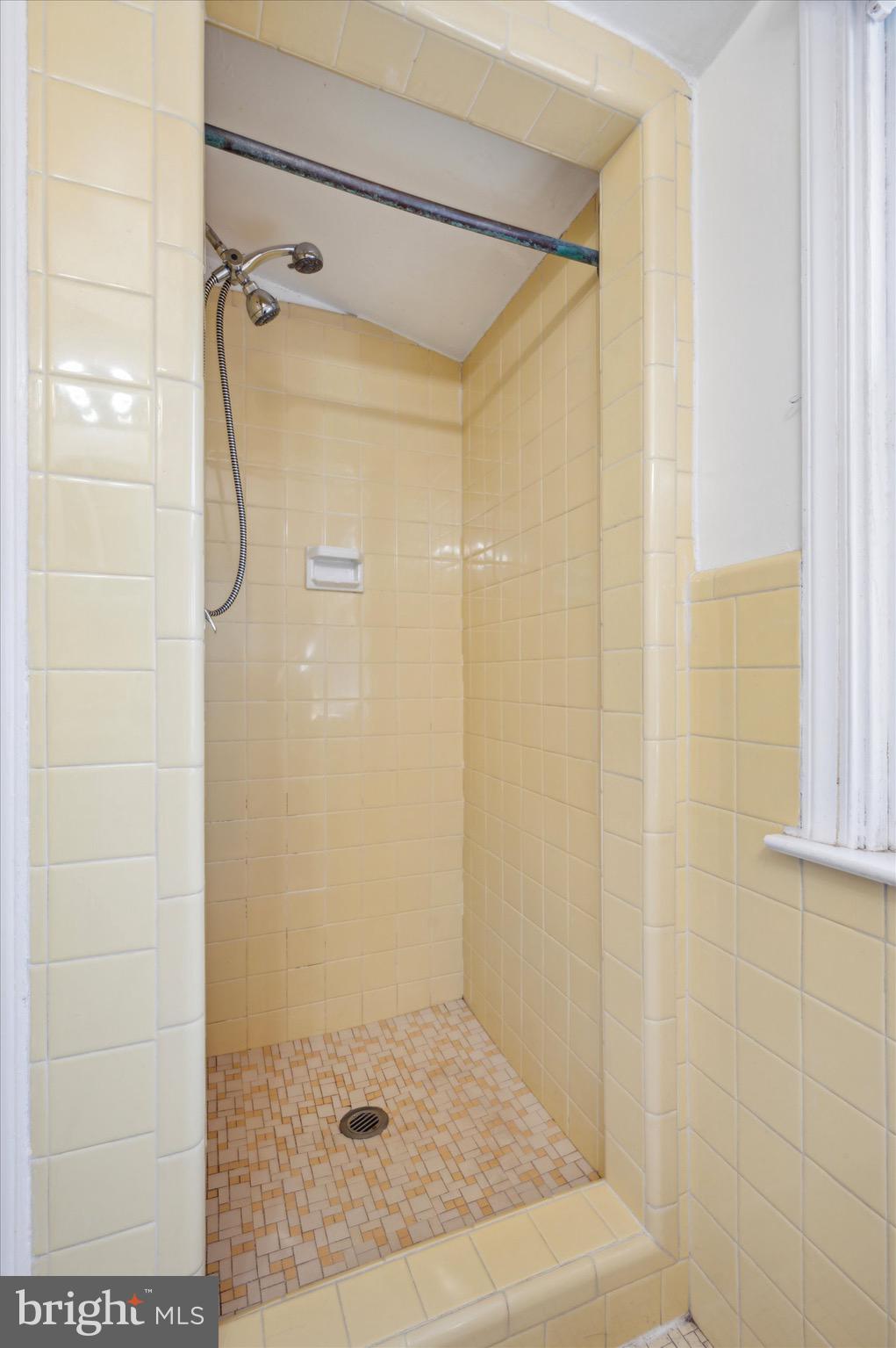 222 Fairhill Road Morton, PA 19070 - Photo 29 of 40 a bathroom with a glass shower door