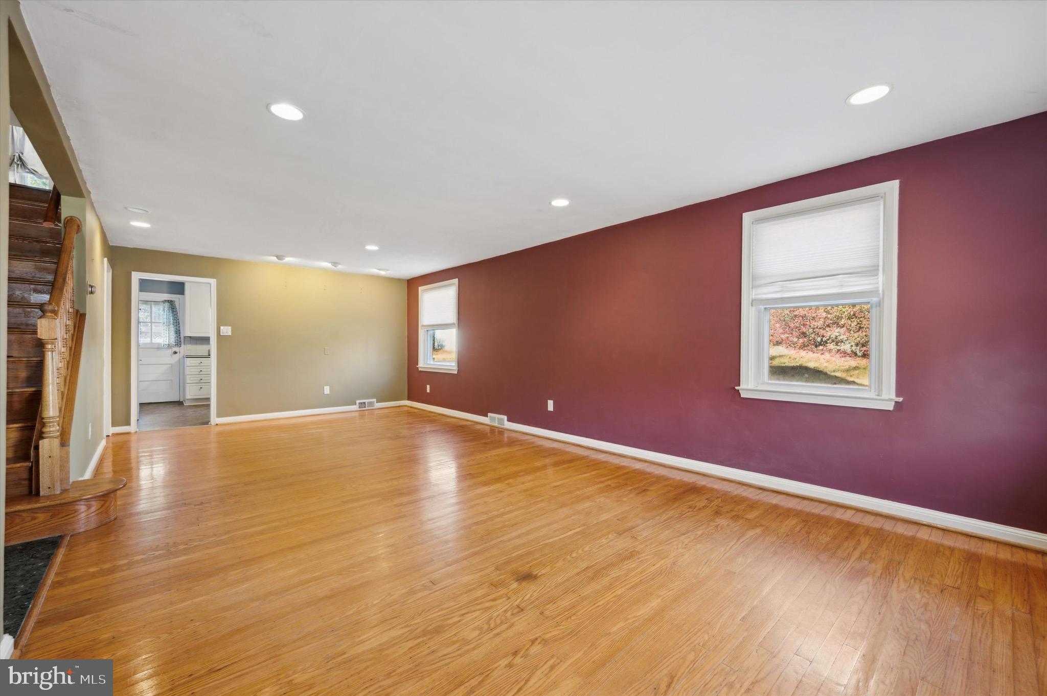 222 Fairhill Road Morton, PA 19070 - Photo 3 of 40 an empty room with wooden floor and windows