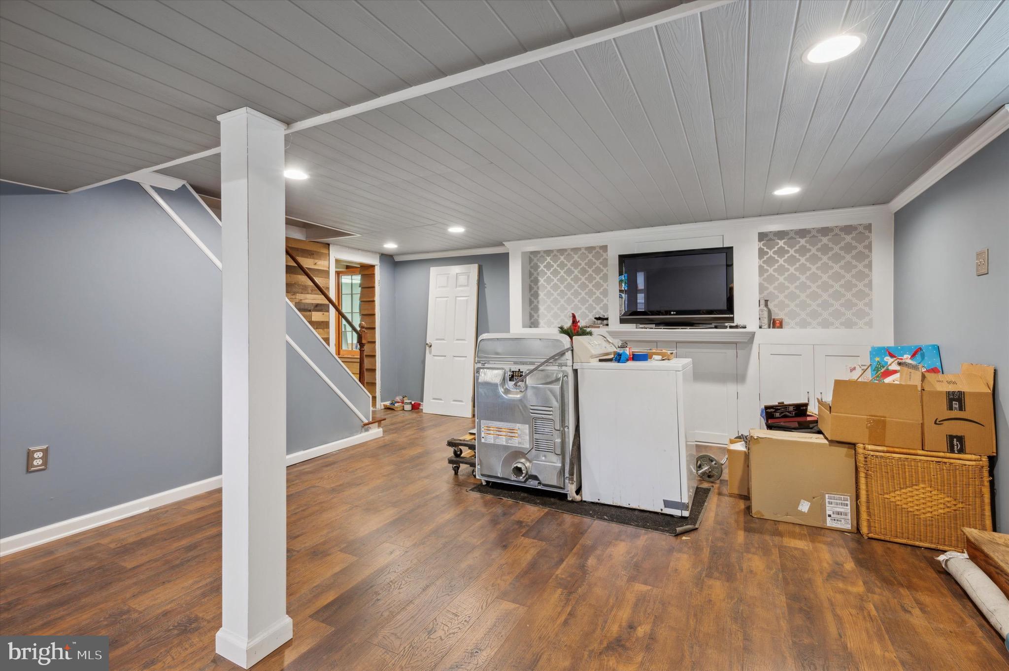 222 Fairhill Road Morton, PA 19070 - Photo 31 of 40 a view of a room with wooden floor and electronic appliances