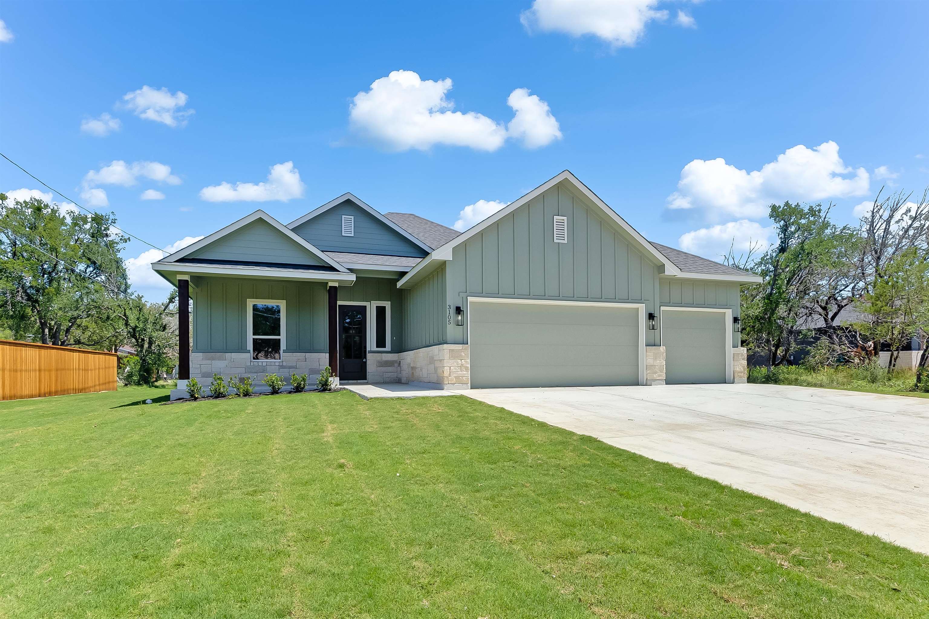 3105 Morgan Circle Marble Falls, TX 78654 - Photo 1 of 1 a front view of a house with a yard and garage