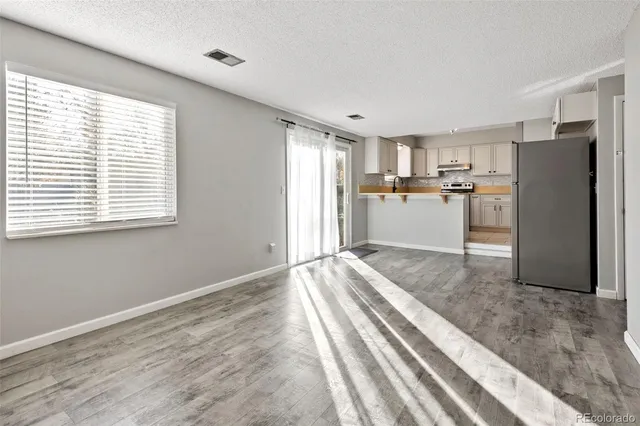 a view of a kitchen with furniture and a window