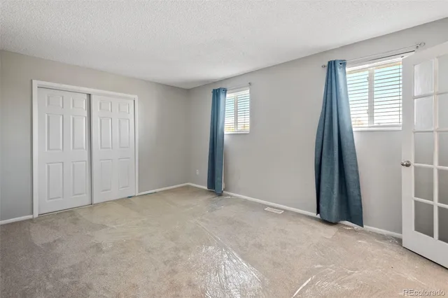 an empty room with windows