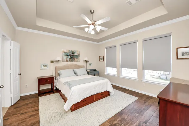 a en suite bathroom with a double vanity sink a mirror and a bathtub