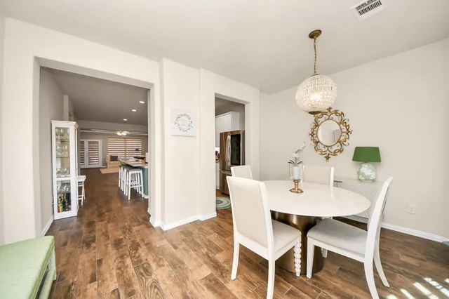 a dining room with furniture and window