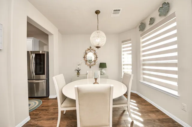 a kitchen with granite countertop kitchen island stainless steel appliances refrigerator stove microwave and cabinets