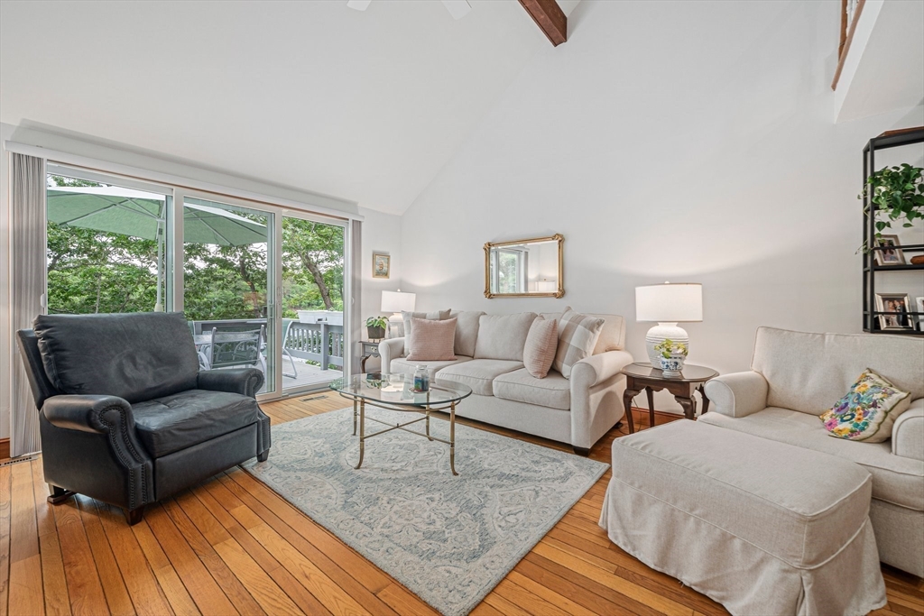 74 Fells Pond Road Mashpee, MA 02649 - Photo 11 of 36 a living room with furniture and a large window