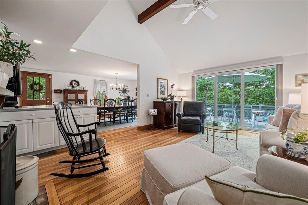 74 Fells Pond Road Mashpee, MA 02649 - Photo 12 of 36 a living room with furniture and a table