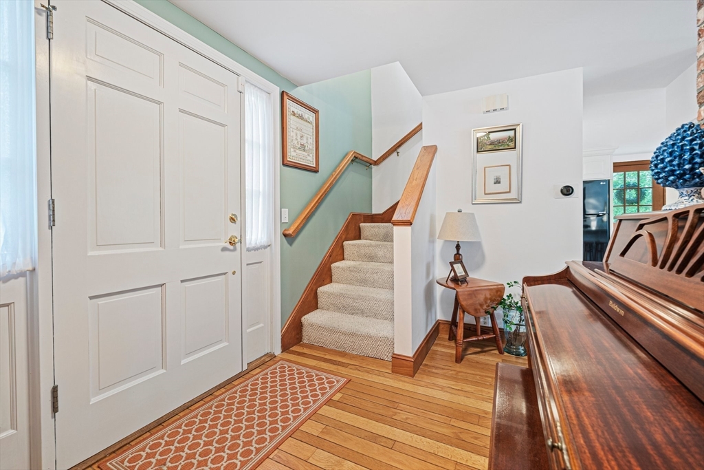 74 Fells Pond Road Mashpee, MA 02649 - Photo 16 of 36 a view of entryway with wooden floor and stairs