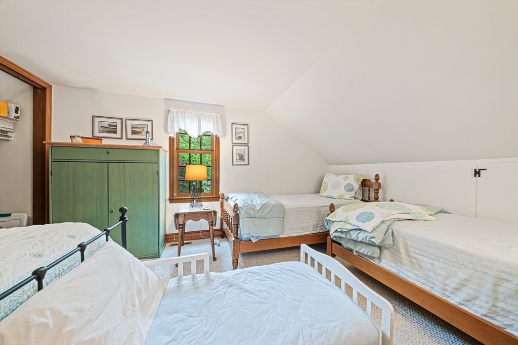 74 Fells Pond Road Mashpee, MA 02649 - Photo 17 of 36 a bedroom with a bed and furniture