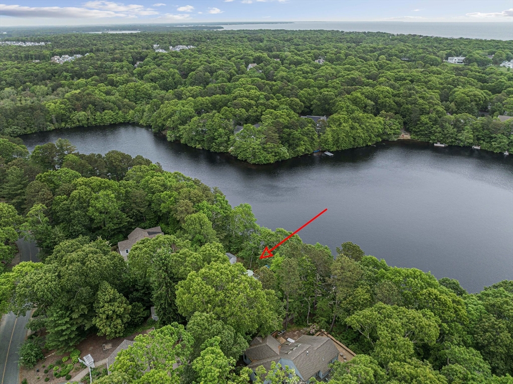 74 Fells Pond Road Mashpee, MA 02649 - Photo 33 of 36 an aerial view of a houses with a yard