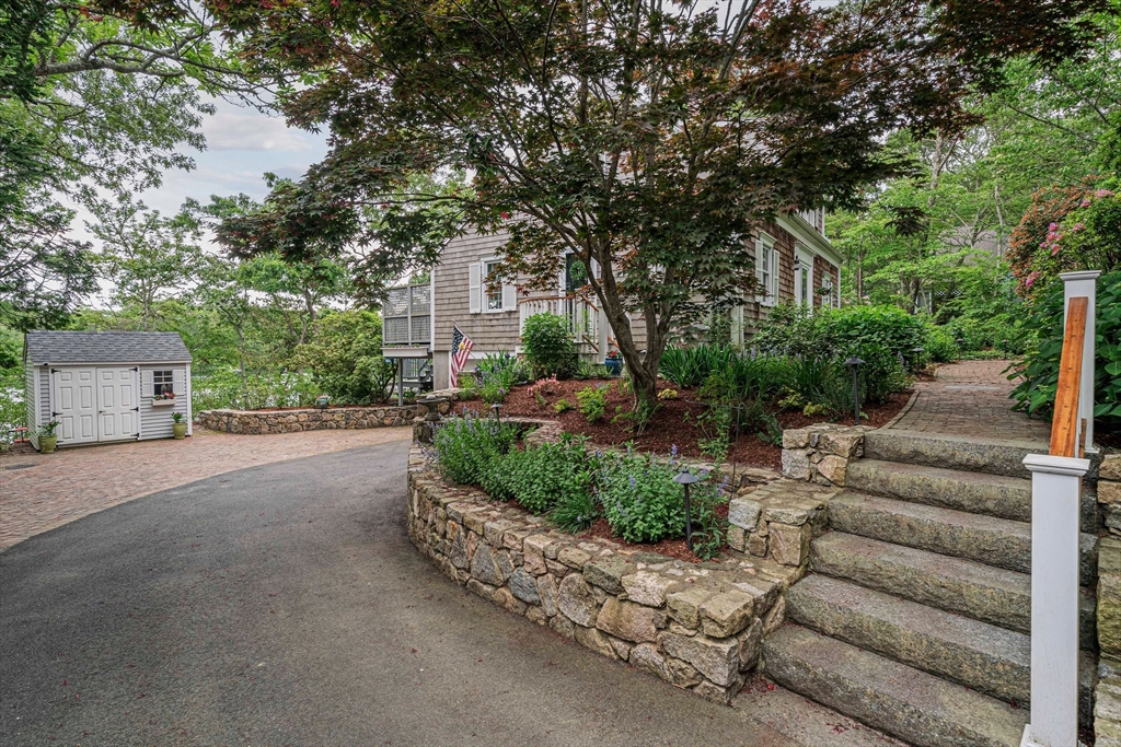 74 Fells Pond Road Mashpee, MA 02649 - Photo 4 of 36 a view of a garden with patio