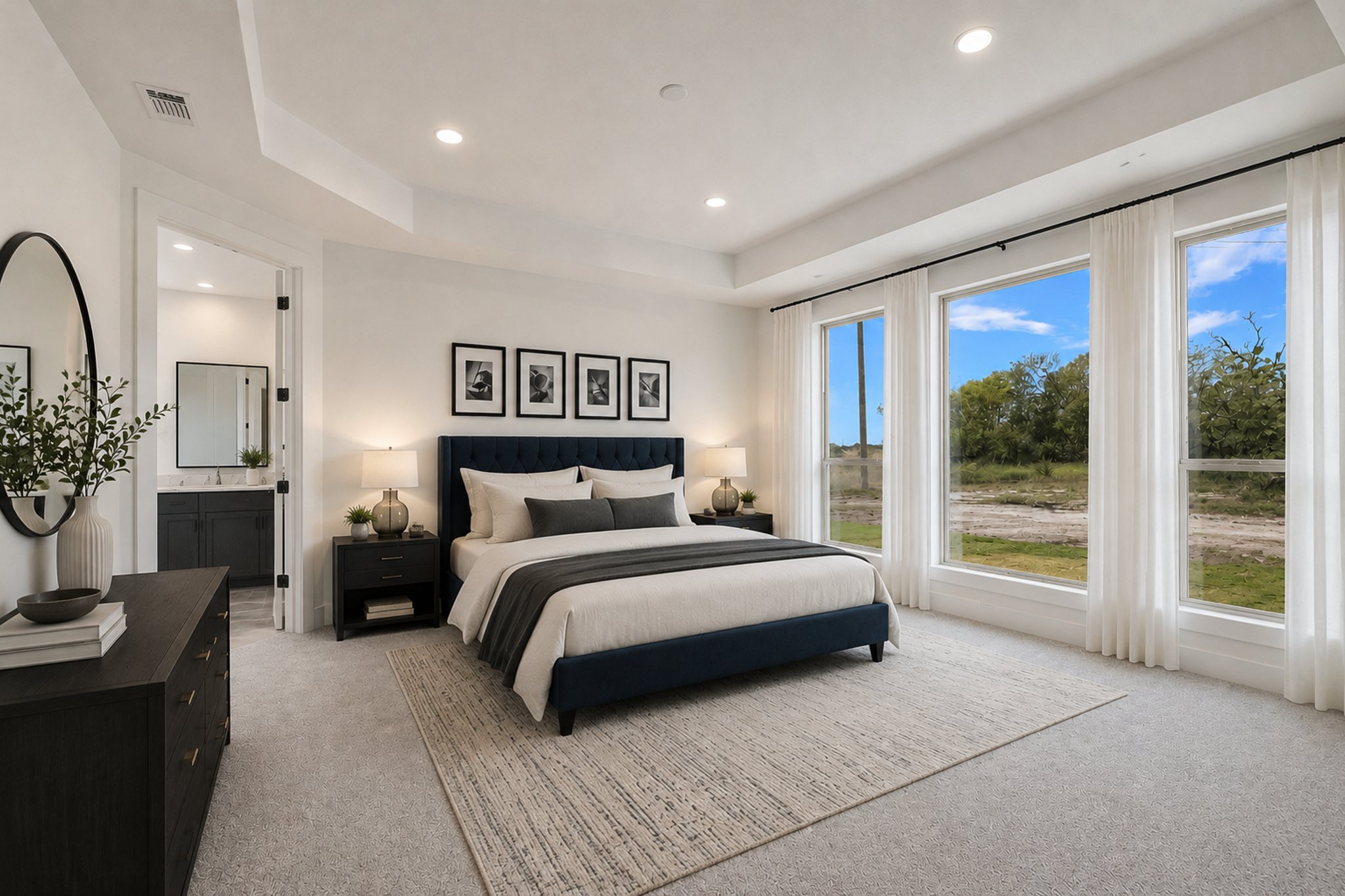 220 Scofield Avenue Georgetown, TX 78626 - Photo 19 of 32 a spacious bedroom with a large bed and a large window