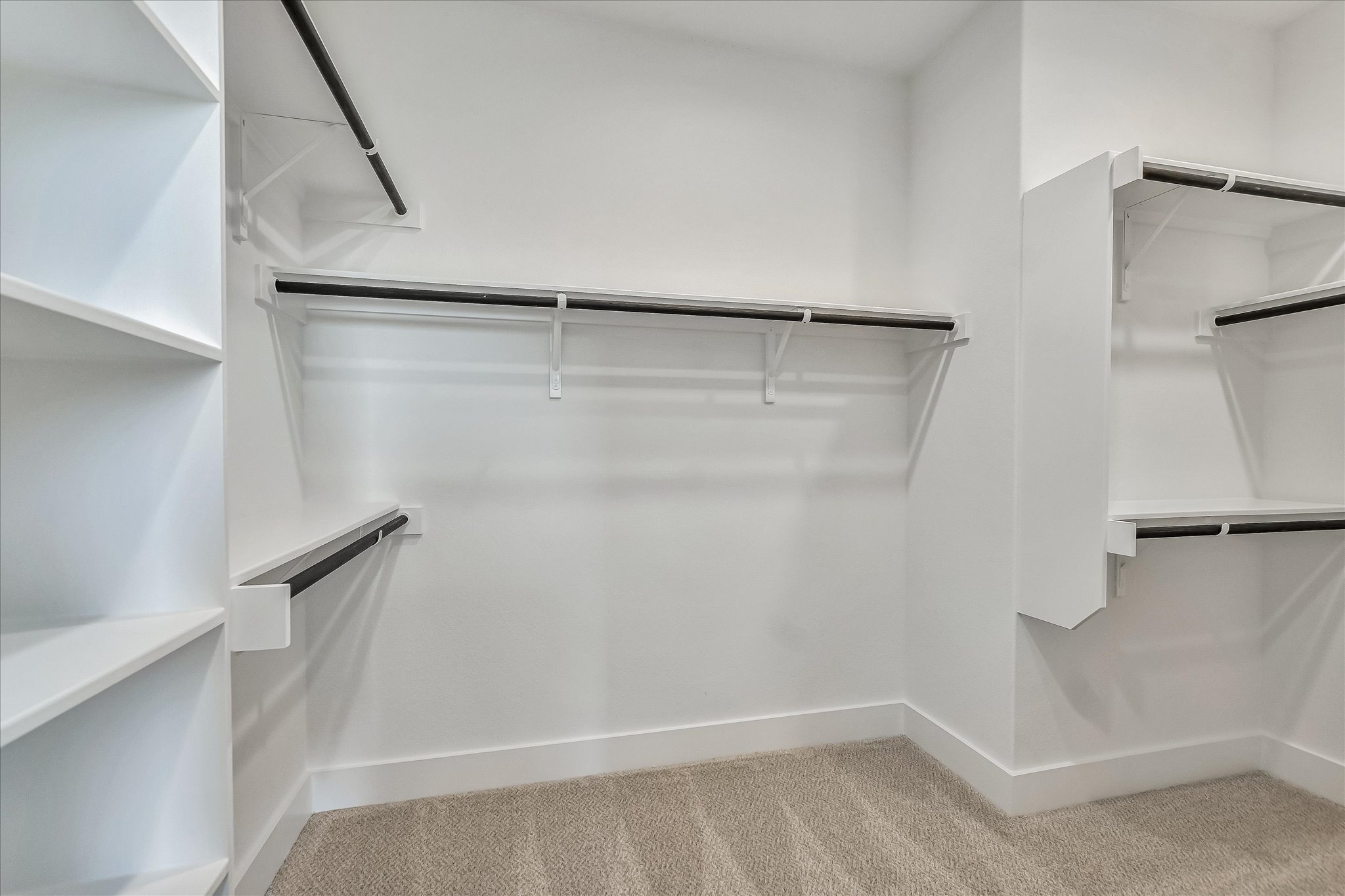 220 Scofield Avenue Georgetown, TX 78626 - Photo 20 of 32 a view of walk in closet with empty racks
