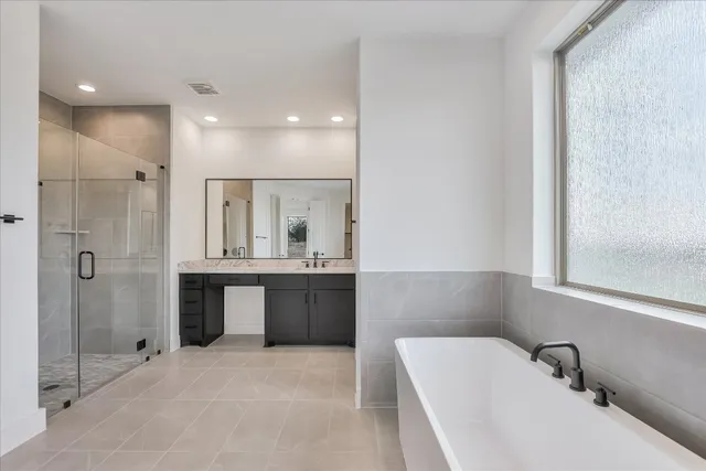 a bathroom with a bathtub and a sink