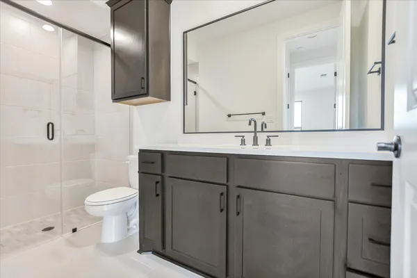 a bathroom with a sink and a shower