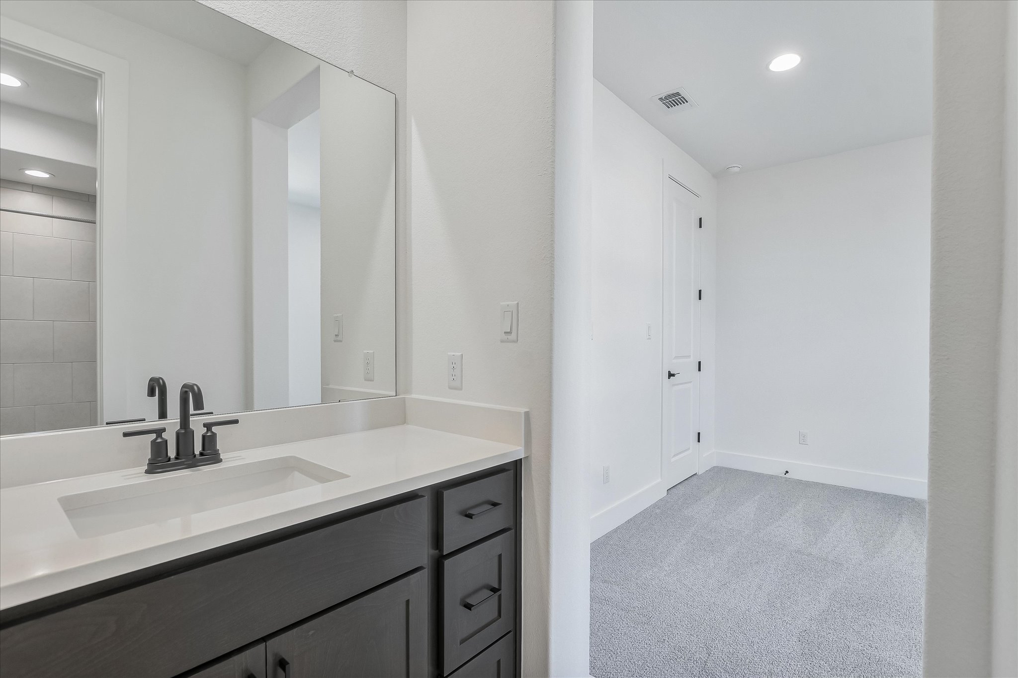 220 Scofield Avenue Georgetown, TX 78626 - Photo 28 of 32 a bathroom with a sink and a mirror