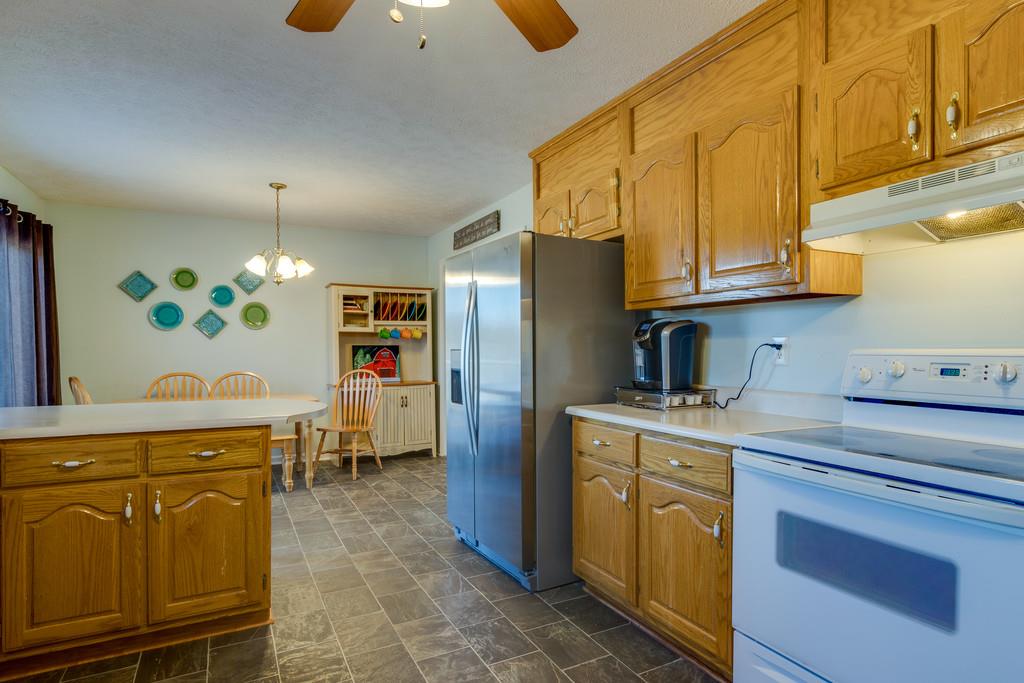 125 Crescent View Cutoff Road Pulaski, TN 38478 - Photo 11 of 30 a kitchen with stainless steel appliances granite countertop a cabinets and a refrigerator