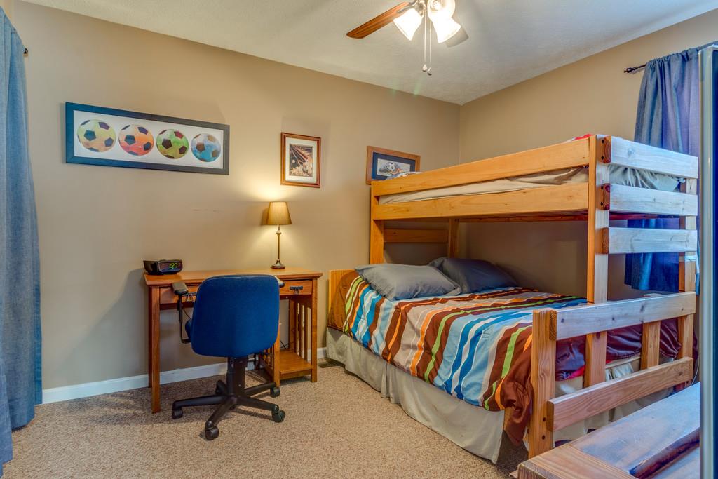 125 Crescent View Cutoff Road Pulaski, TN 38478 - Photo 21 of 30 a bedroom with a bed and a bookshelf in it