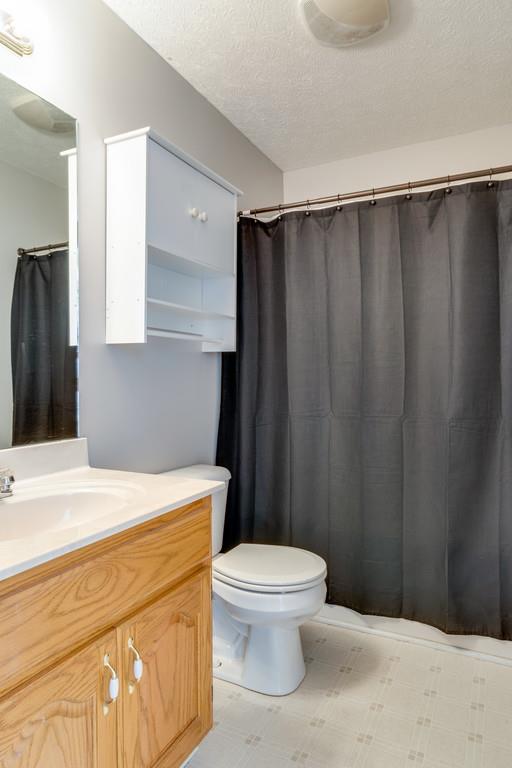125 Crescent View Cutoff Road Pulaski, TN 38478 - Photo 23 of 30 a bathroom with a sink a toilet a vanity and mirror