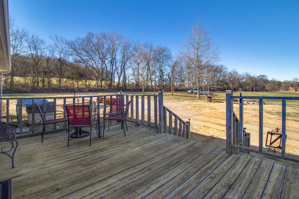 125 Crescent View Cutoff Road Pulaski, TN 38478 - Photo 26 of 30 a view of a balcony with wooden floor and outdoor space