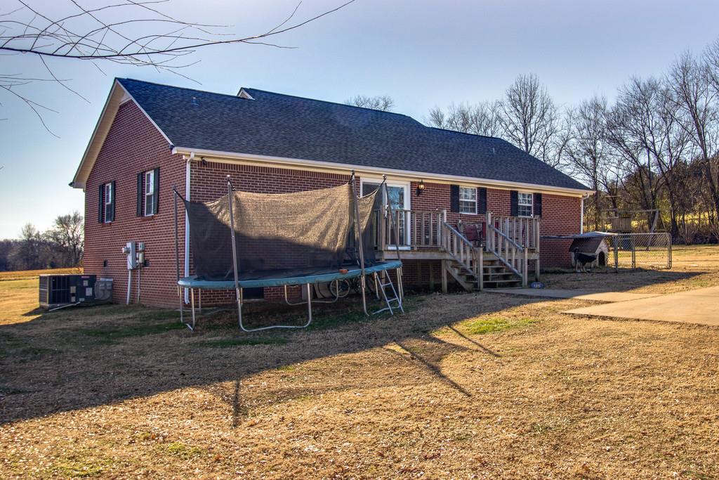 125 Crescent View Cutoff Road Pulaski, TN 38478 - Photo 29 of 30 a backyard of a house with yard and outdoor seating