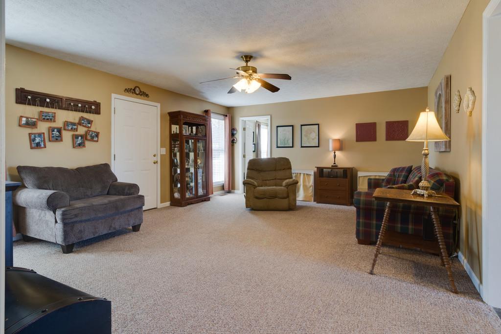 125 Crescent View Cutoff Road Pulaski, TN 38478 - Photo 4 of 30 a living room with furniture and a chandelier