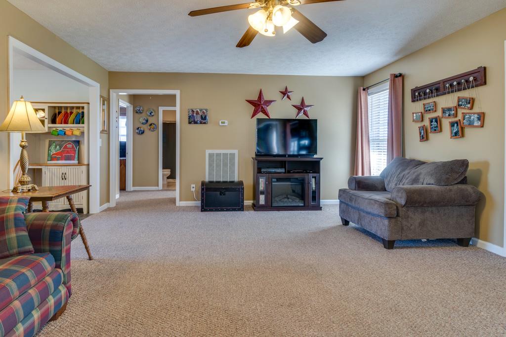 125 Crescent View Cutoff Road Pulaski, TN 38478 - Photo 7 of 30 a living room with furniture and a flat screen tv