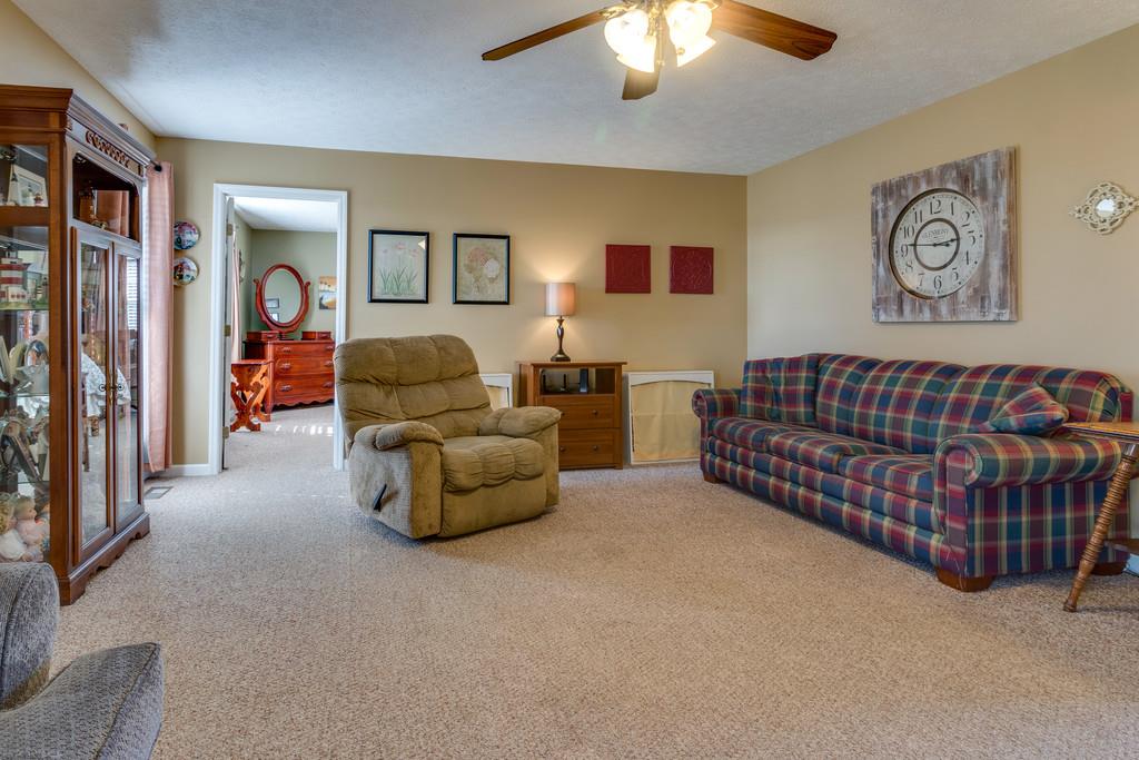 125 Crescent View Cutoff Road Pulaski, TN 38478 - Photo 8 of 30 a living room with furniture and a chandelier