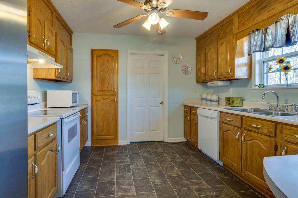 125 Crescent View Cutoff Road Pulaski, TN 38478 - Photo 9 of 30 a kitchen with a sink stove and cabinets