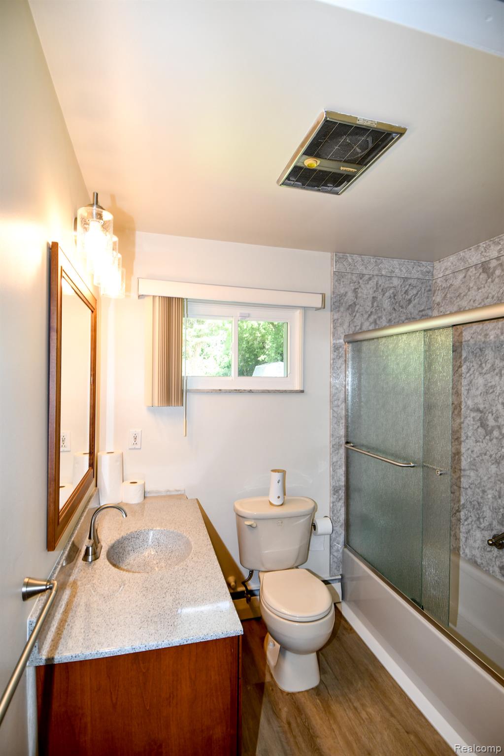 6443 Richfield Road Flint, MI 48506 - Photo 26 of 40 Bathroom with combined bath / shower with glass door, vanity, and wood finished floors