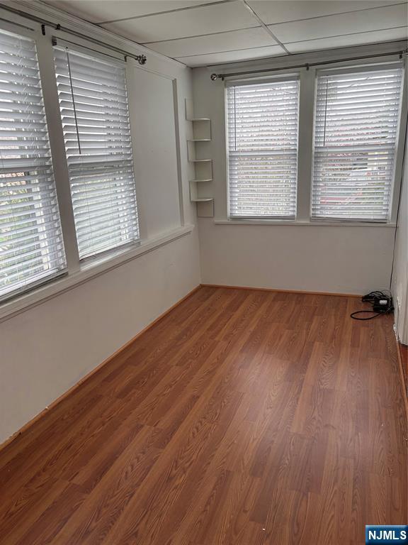 35 Charles Street, Unit 1 Little Ferry, NJ 07643 - Photo 11 of 21 a view of empty room with wooden floor and fan