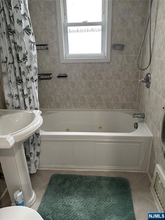35 Charles Street, Unit 1 Little Ferry, NJ 07643 - Photo 16 of 21 a bathroom with a sink a toilet and a bathtub
