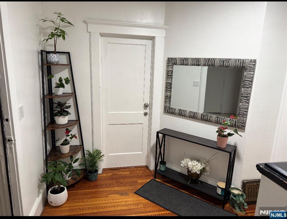 35 Charles Street, Unit 1 Little Ferry, NJ 07643 - Photo 3 of 21 a living room with furniture and a fireplace