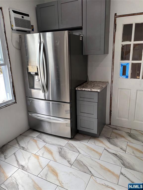 35 Charles Street, Unit 1 Little Ferry, NJ 07643 - Photo 8 of 21 a kitchen with stainless steel appliances granite countertop a refrigerator and a stove top oven