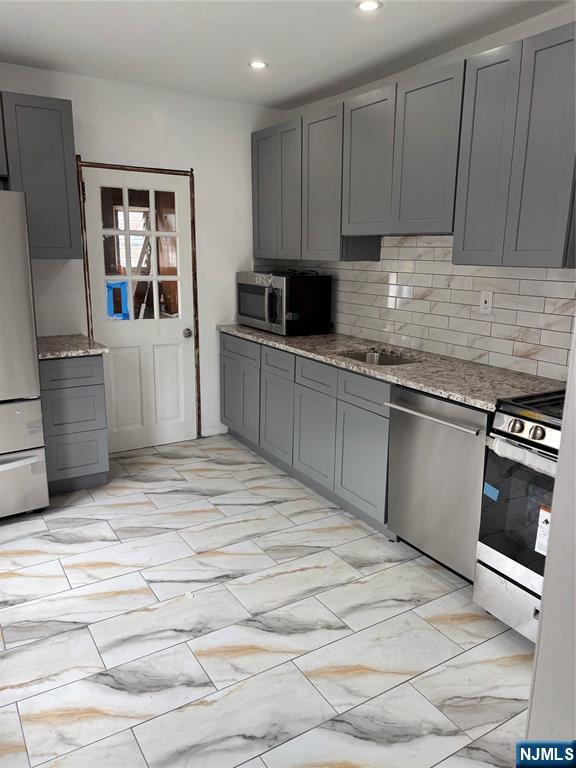 35 Charles Street, Unit 1 Little Ferry, NJ 07643 - Photo 9 of 21 a kitchen with a sink cabinets and appliances