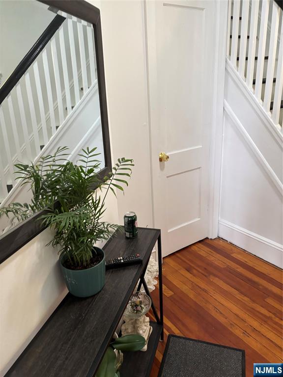 35 Charles Street, Unit 1 Little Ferry, NJ 07643 - Photo 10 of 21 a room with wooden floor and chair