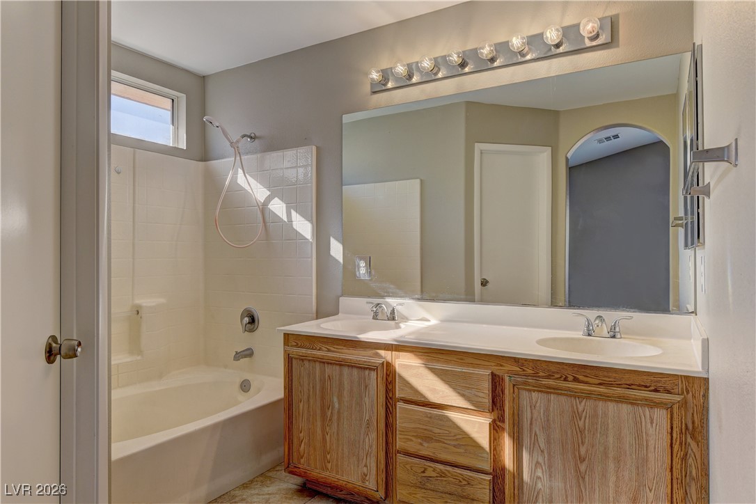 3328 Strawberry Roan Road North Las Vegas, NV 89032 - Photo 10 of 11 Bathroom with shower / tub combination, double vanity, and light tile patterned floors