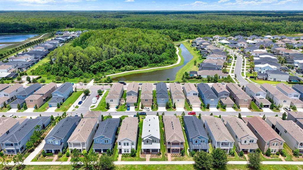 13729 Rangeland Boulevard Odessa, FL 33556 - Photo 24 of 30 a view of multiple houses with yard