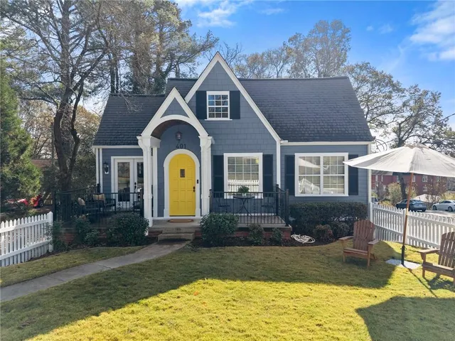 a view of a house with swimming pool and sitting area