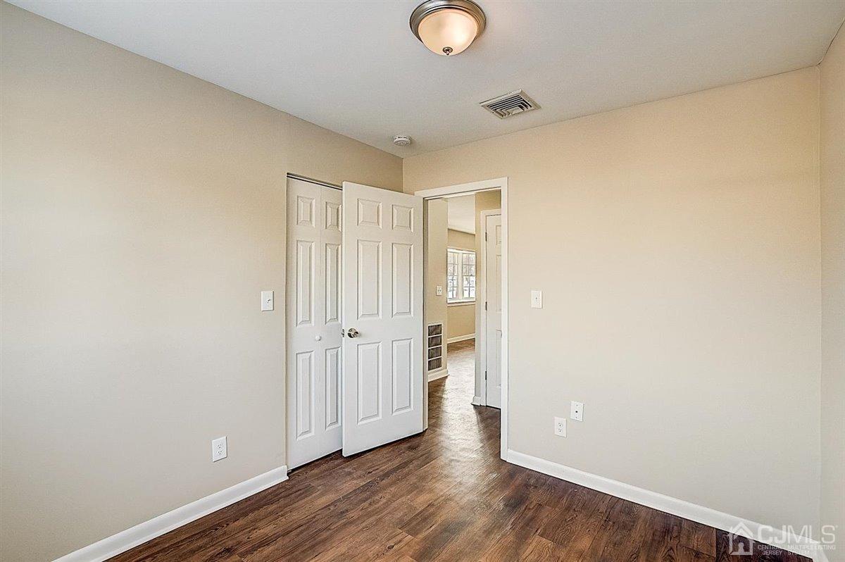 17 Cambridge Road Kendall Park, NJ 08824 - Photo 24 of 28 a view of a room with wooden floor