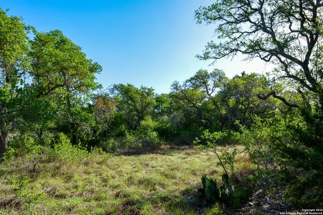 a bedroom with a bed and a chair