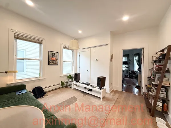 a bed room with a bed and a window