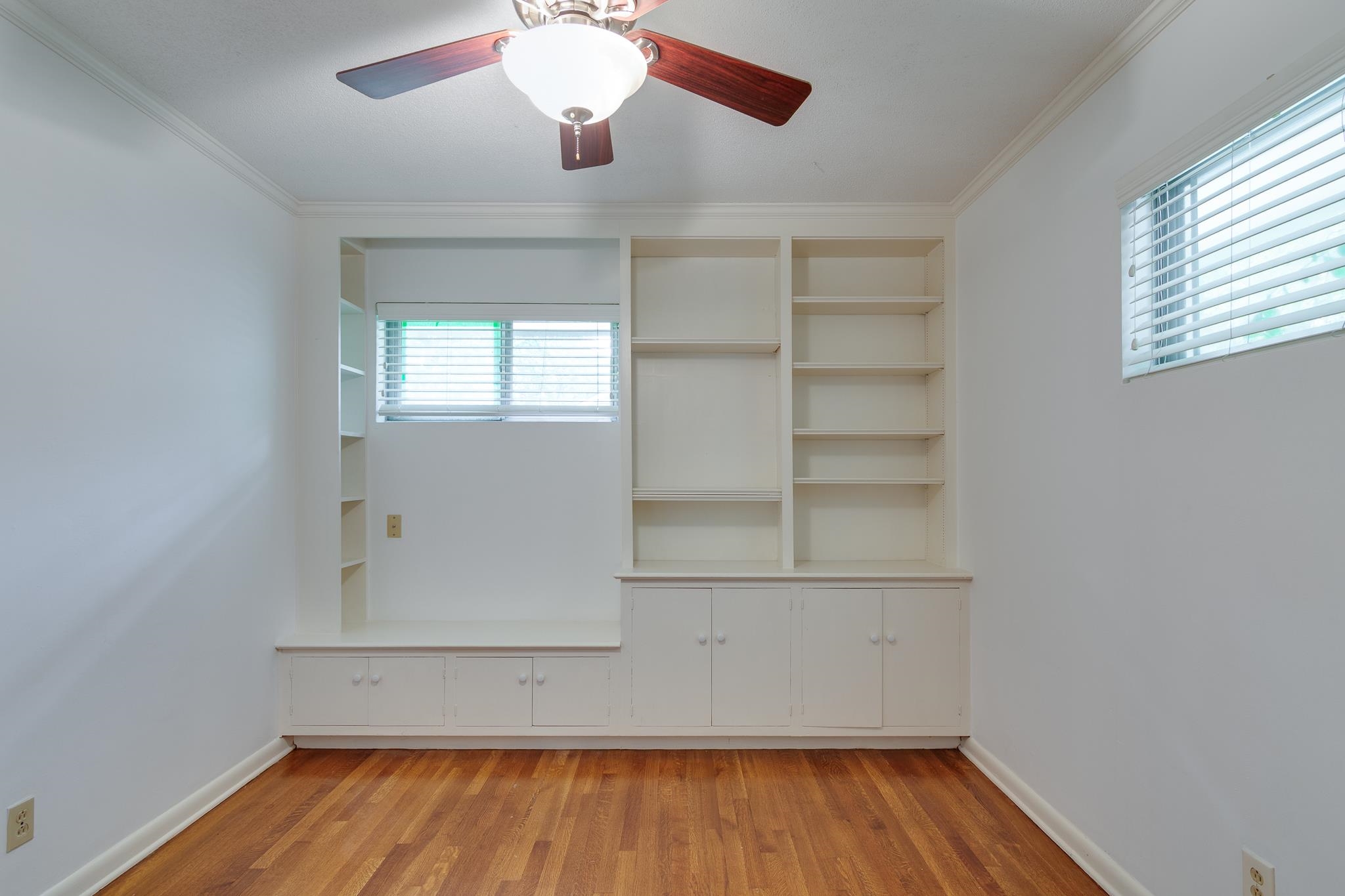 2021 Sunset Road Germantown, TN 38138 - Photo 16 of 26 Spare room featuring baseboards, light wood-style flooring, and crown molding