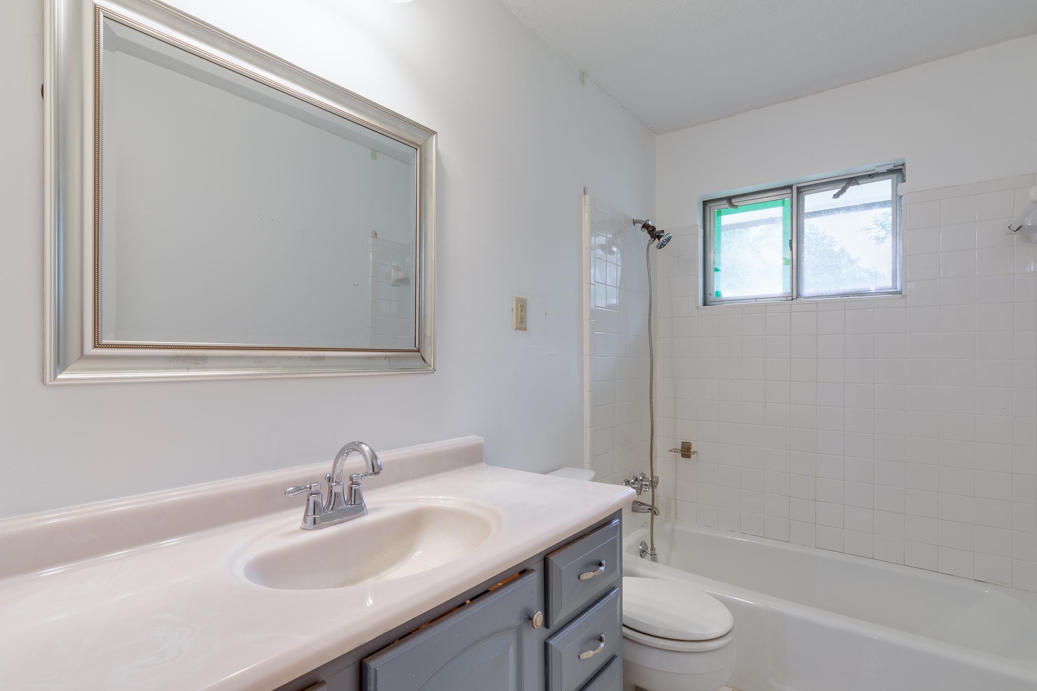 2021 Sunset Road Germantown, TN 38138 - Photo 17 of 26 Full bathroom with vanity, bathing tub / shower combination, and toilet