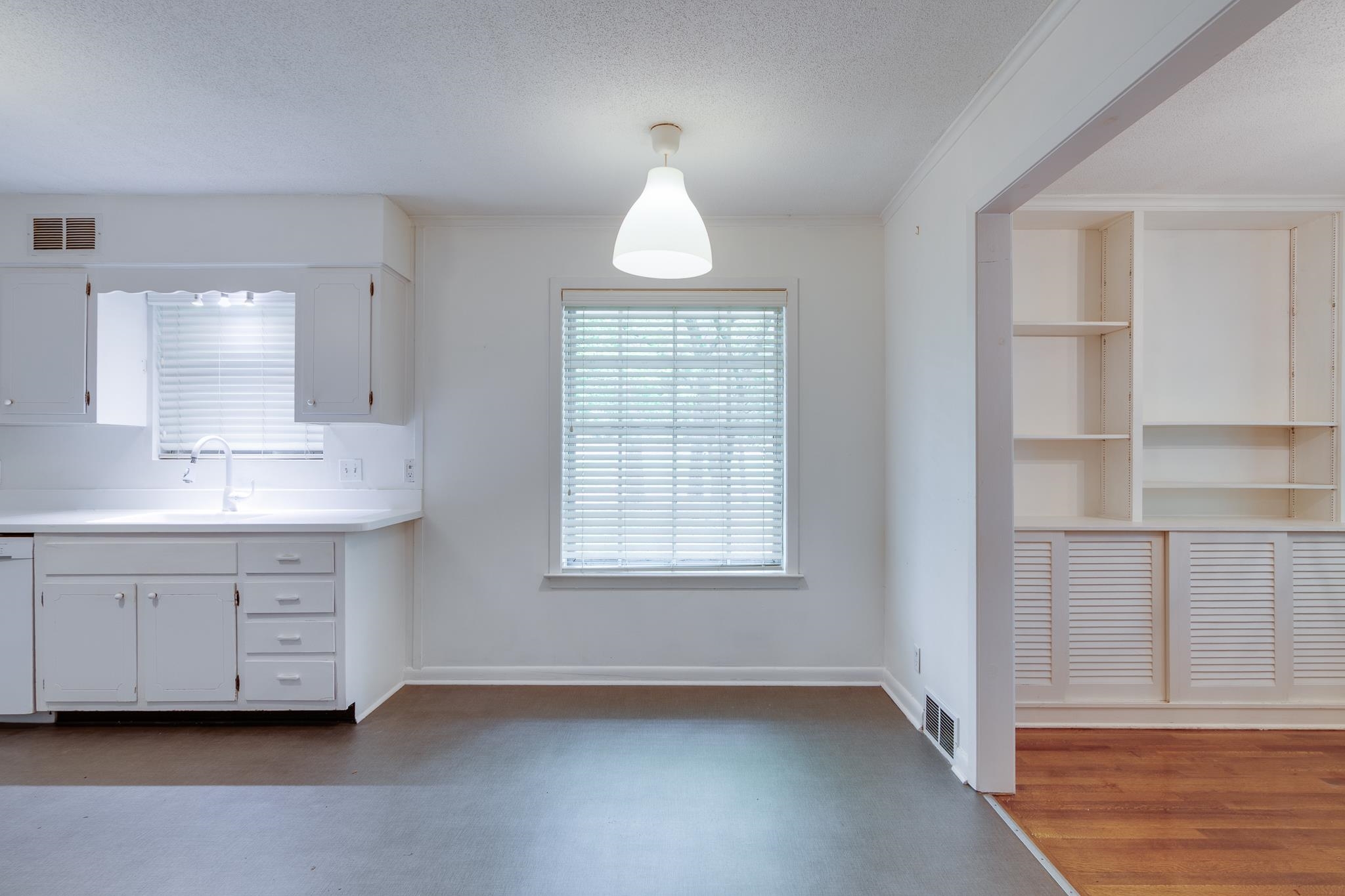2021 Sunset Road Germantown, TN 38138 - Photo 6 of 26 Kitchen with visible vents, a sink, white cabinets, and light countertops