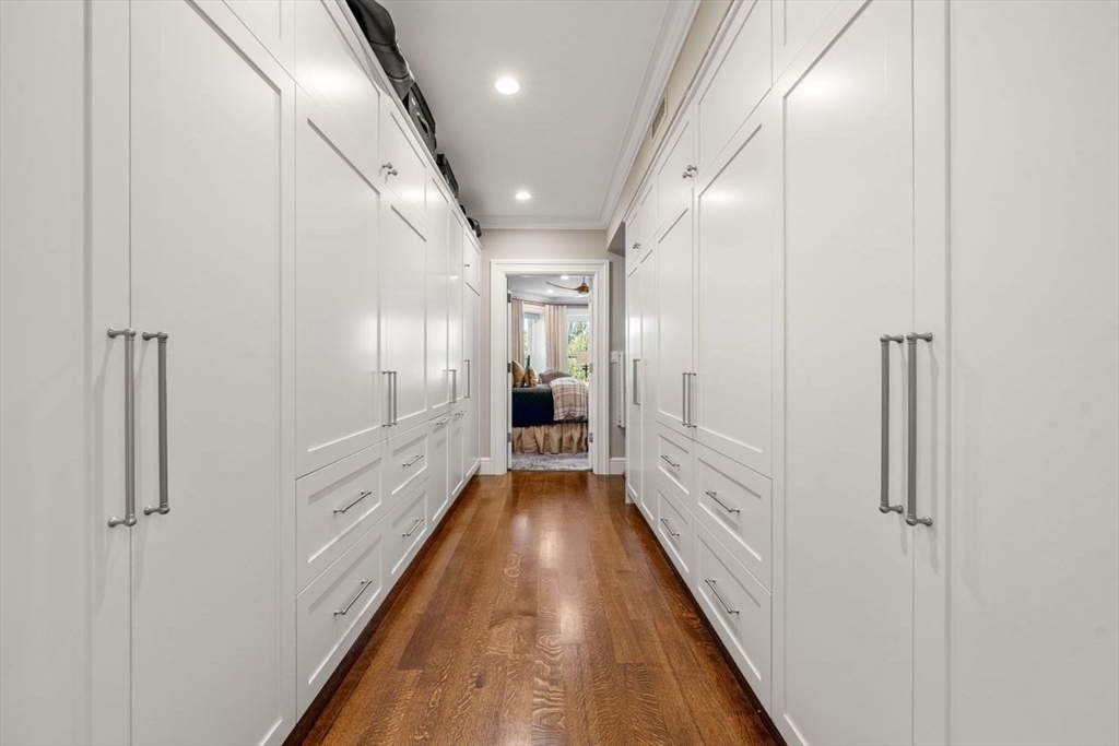 288 Commonwealth Avenue, Unit 3 Boston, MA 02115 - Photo 17 of 25 a view of a hallway with wooden floor and staircase