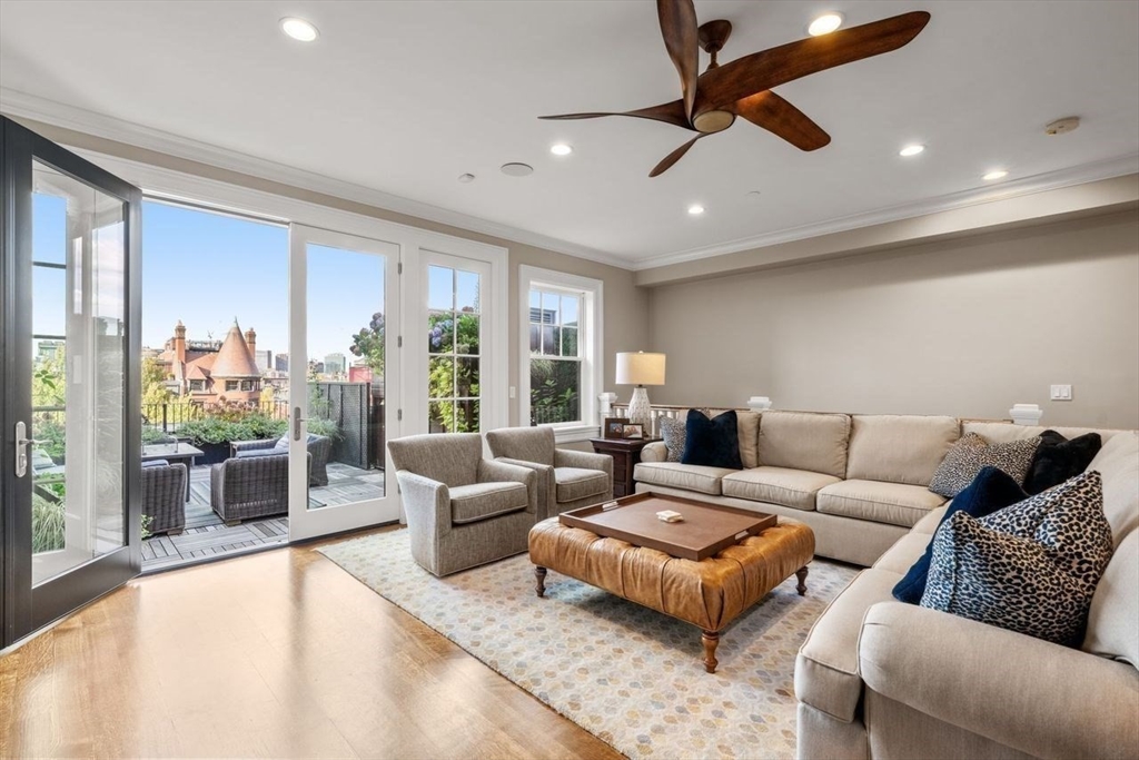 288 Commonwealth Avenue, Unit 3 Boston, MA 02115 - Photo 19 of 25 a living room with furniture and a large window