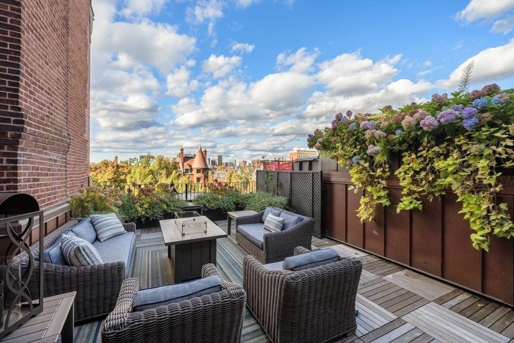 288 Commonwealth Avenue, Unit 3 Boston, MA 02115 - Photo 22 of 25 a balcony with furniture and a potted plant