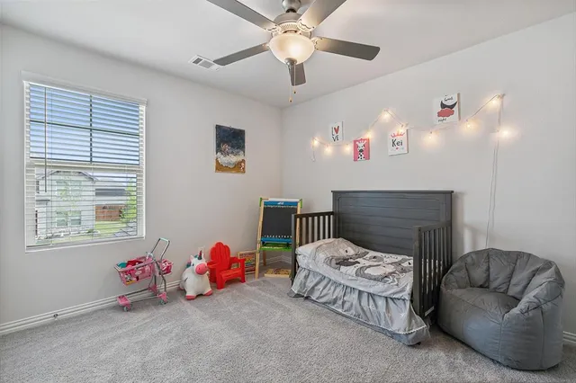 a bedroom with furniture and a chandelier