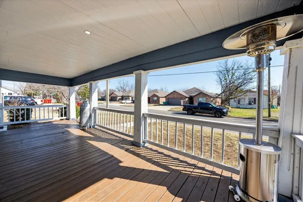 a view of a balcony with wooden floor